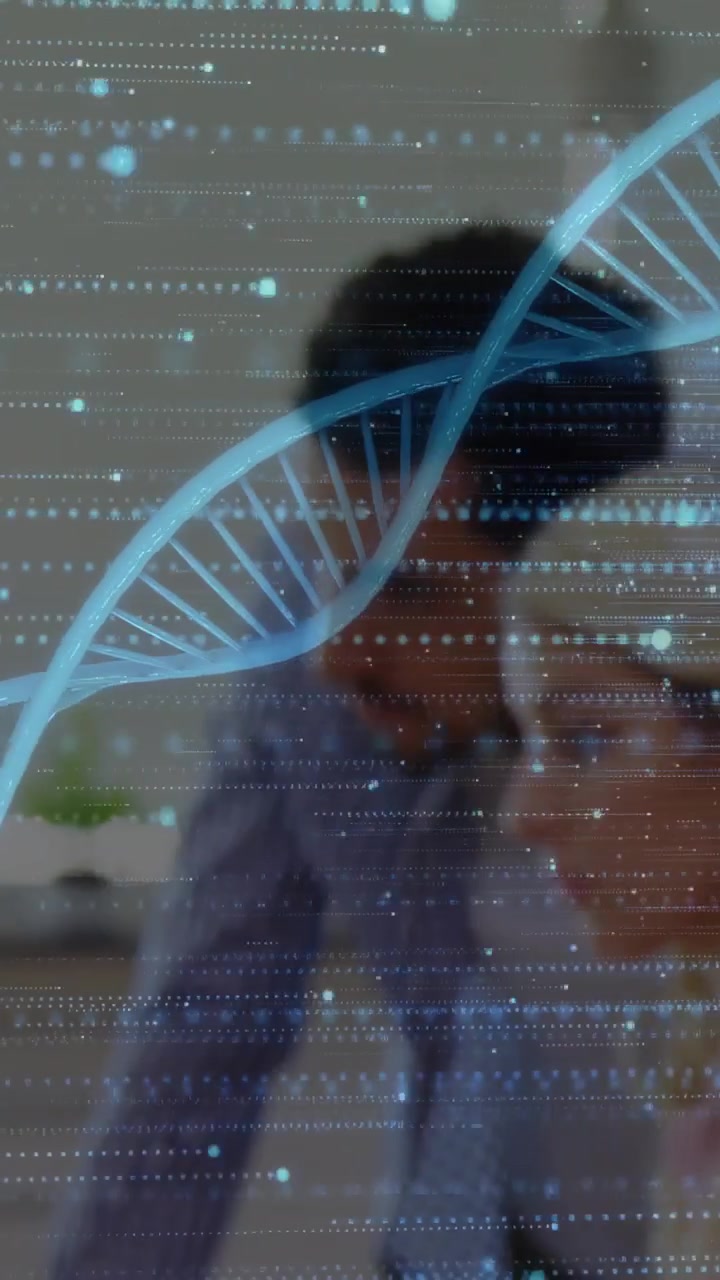 Male scientist leaning toward PC, consulting woman, examining overlaid DNA helix HUD for research