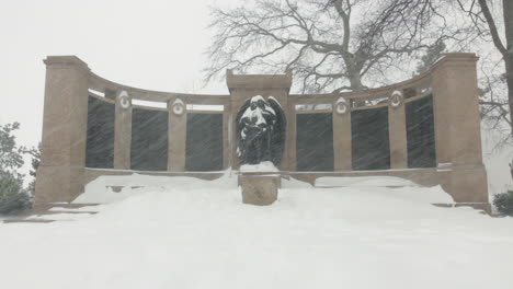 this is a shot of a statue getting covered in snow during a blizzard-snowstorm in prospect park in brooklyn, ny