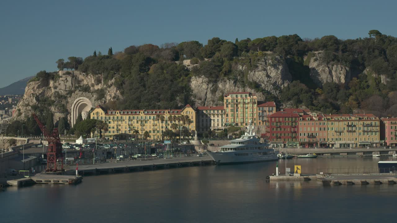Aerial view of the Nice seaport with a big yacht and mountains in background
lot of boats