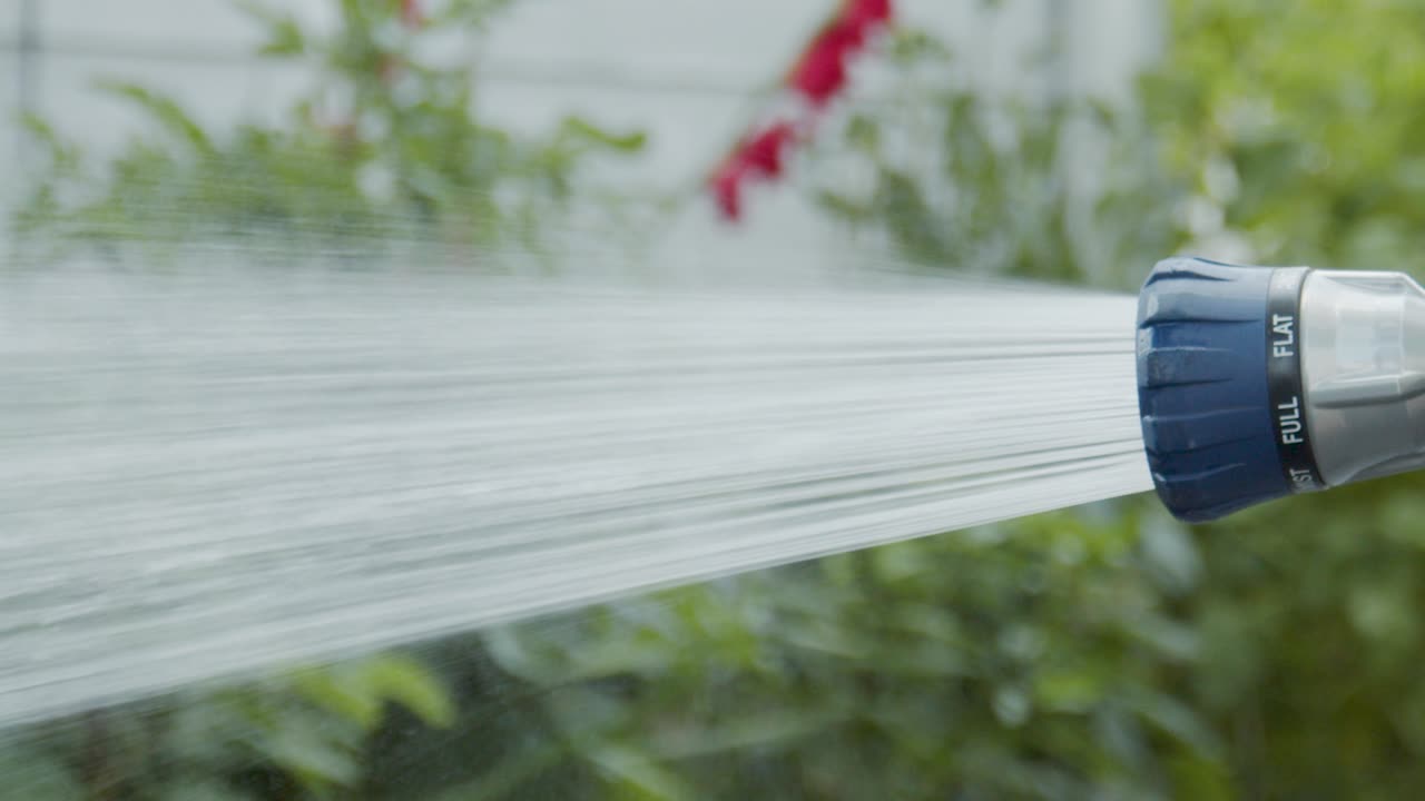 Garden plant sprayer sprays water in slow motion