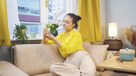 A-lively-and-energetic-young-woman.-Laughing-out-the-window-with-happy-expression.