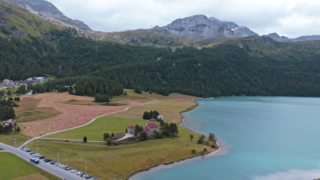 Scenic view of lake near Silvaplana with serene mountain backdrop