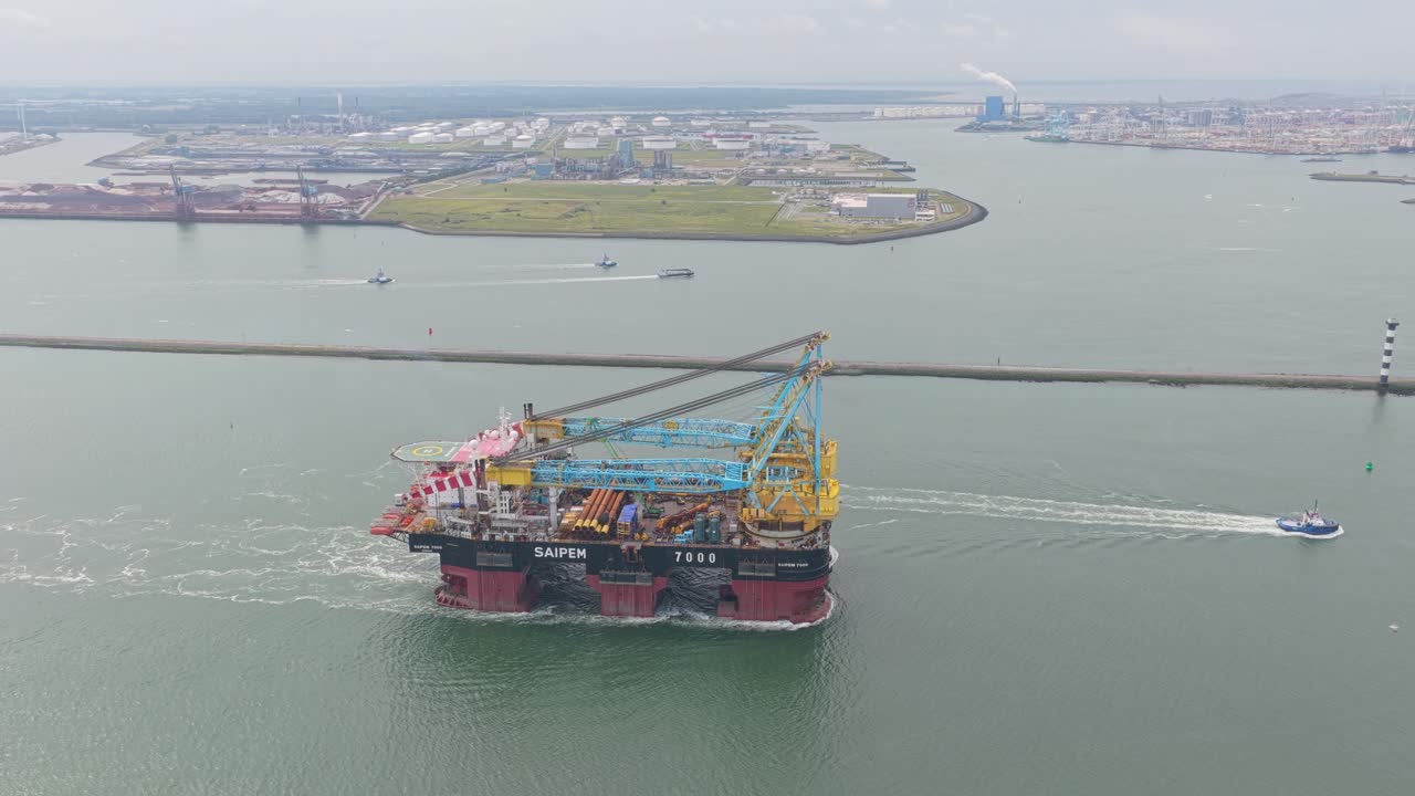 Daytime view of pipelay crane ship navigating in Rotterdam port, Netherlands