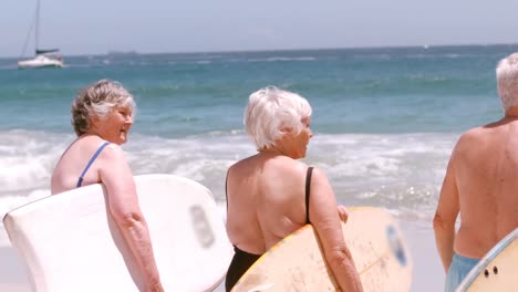 senior friends going to surf