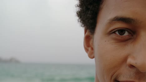 close-up of african american man standing on the beach 4k