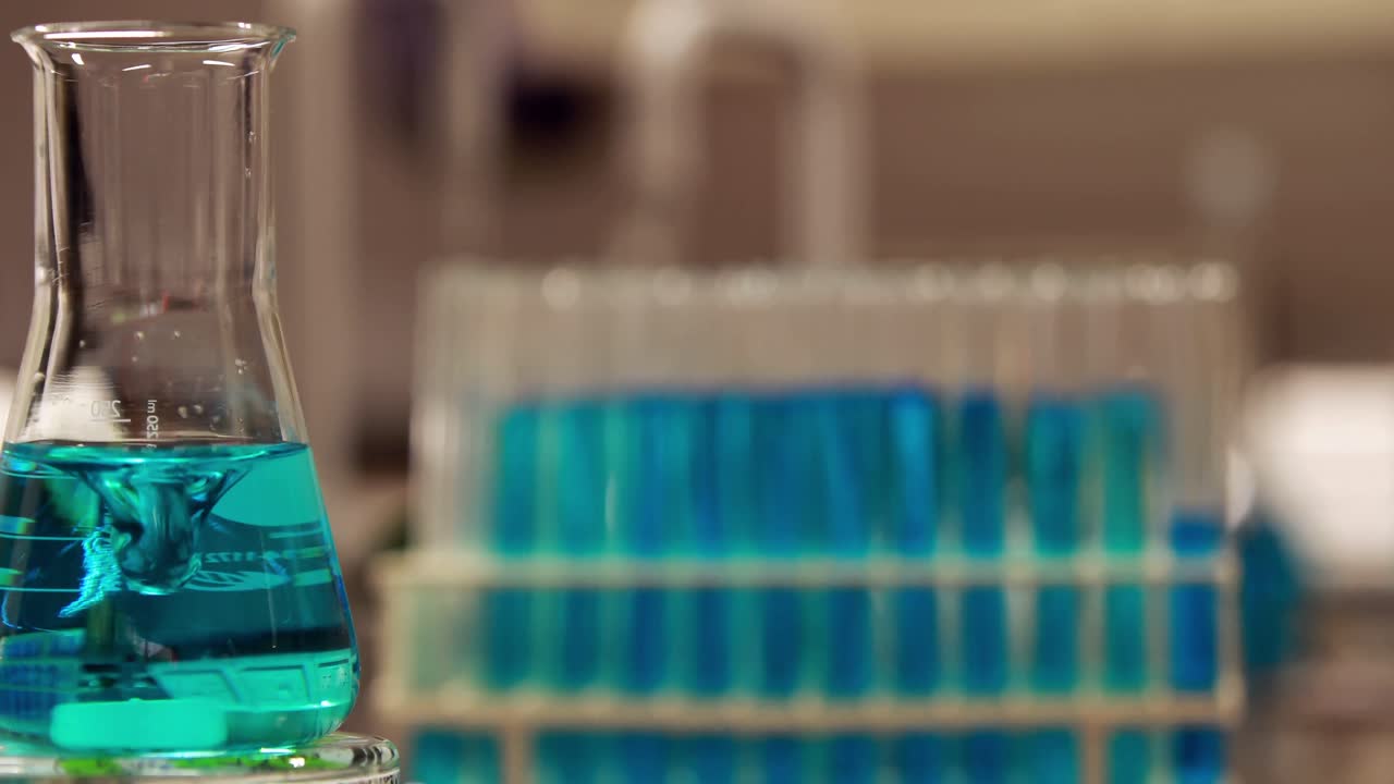 Blue chemical swirling in beaker