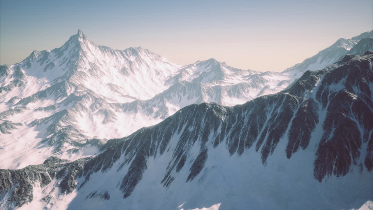 Stunning snow covered mountain range under a clear sky during daytime