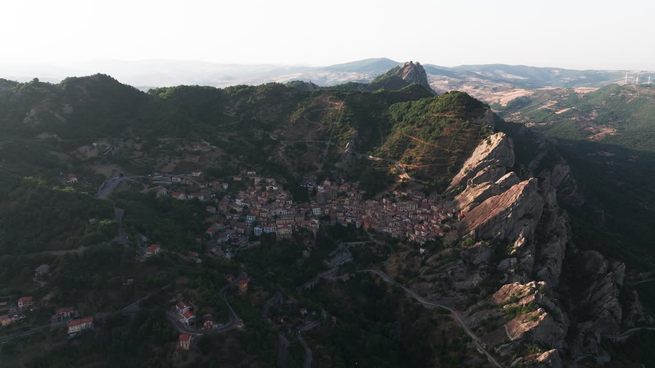 Drone footage of Castelmezzano, Italy. Picturesque mountain village with dramatic cliffs, historic charm and breathtaking views. Ideal for travel, tourism, destination and cultural stock footage