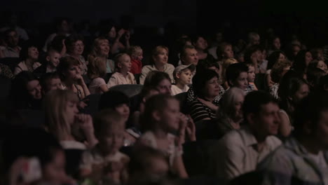 children watching a show at the theatre 1