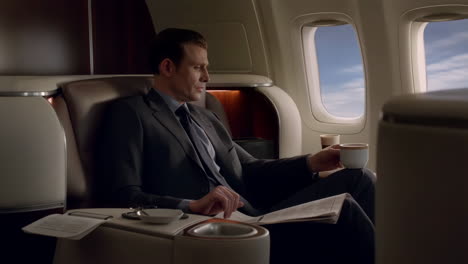 businessman in a suit relaxing in a luxury airplane cabin