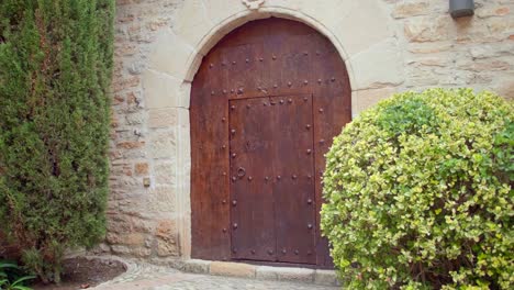 medieval wooden door of historic cobblestone building