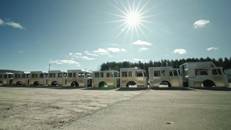 array of unfinished fire trucks under the bright sun,industrial assembly and emergency vehicle production