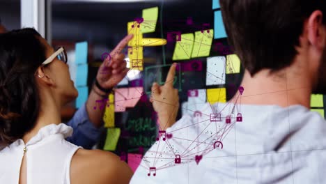 animation of data processing over diverse business people taking notes on glass wall