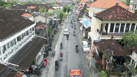 Aerial-shot-on-a-street-with-a-lot-of-traffic-of-trucks,-cars-and-motorcycles