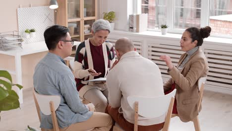 upset unrecognizable man on group meeting