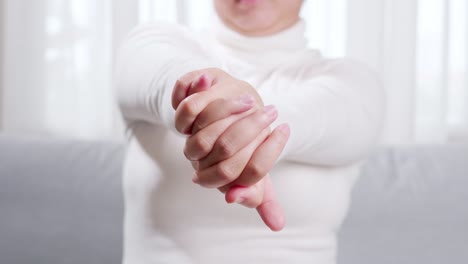 close up of woman doing hand massage and stretching for soothing and relaxing