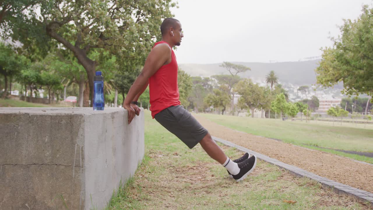 Side view man with prosthetic leg exercising