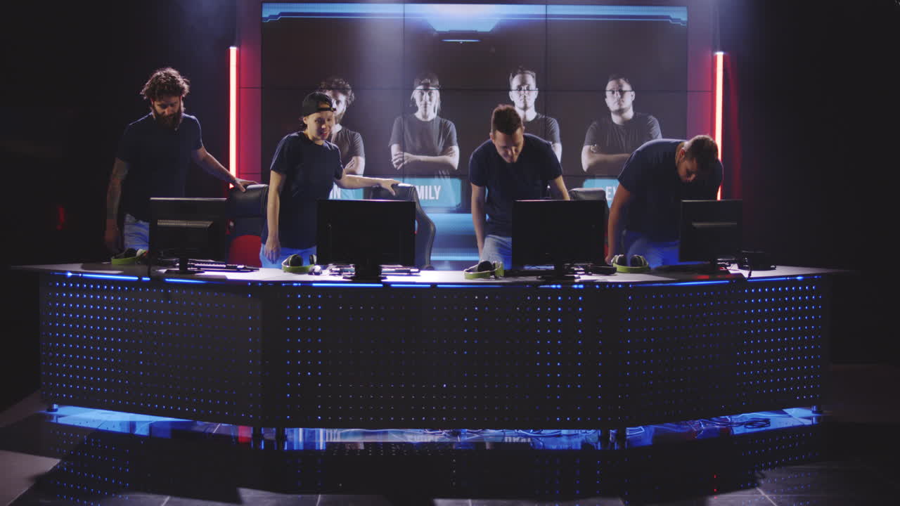 Gaming Team Sitting down at Computers Medium Closeup of a Team Sitting down at their Computers at a Gaming Tournament
