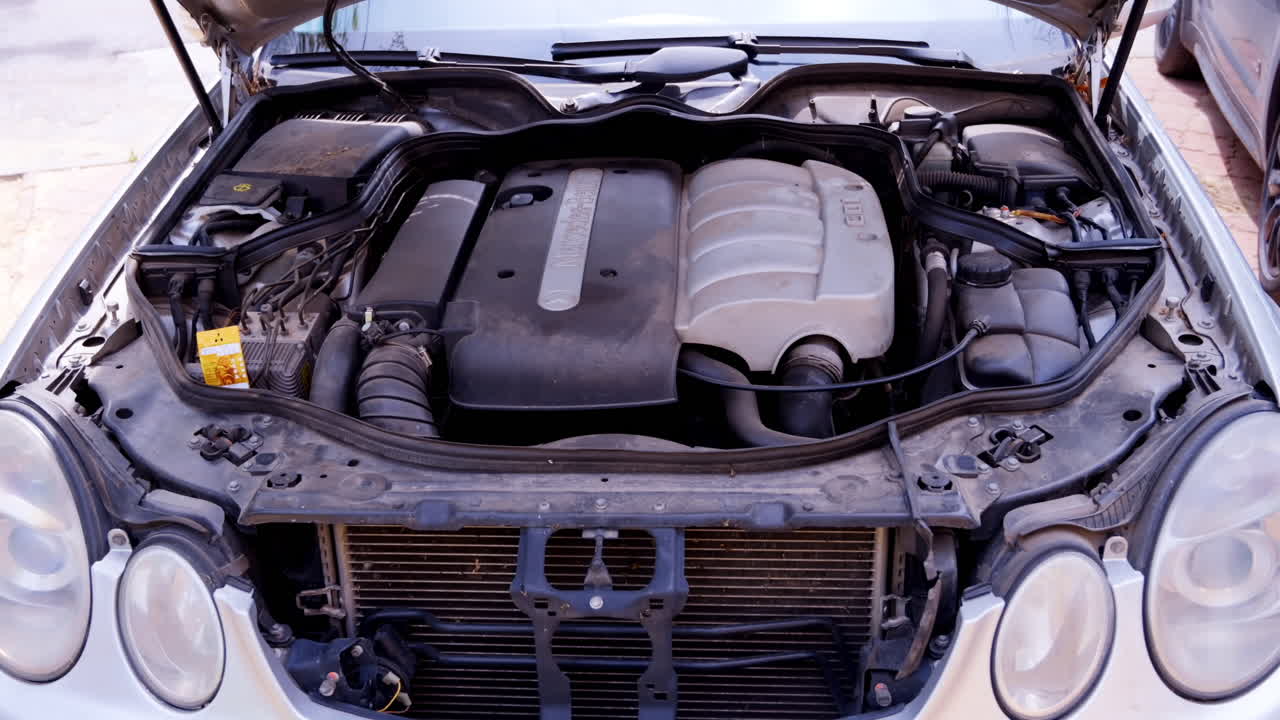 Chisinau, Moldova - April 21, 2022: The engine bay of a Mercedes-Benz E-Class car