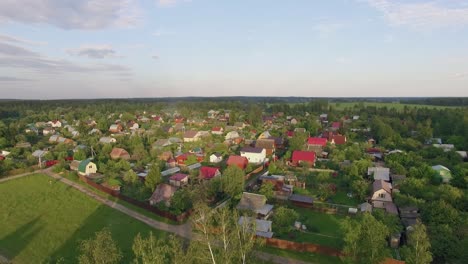 Aerial-shot-of-village-highway-and-green-nature-in-Russia