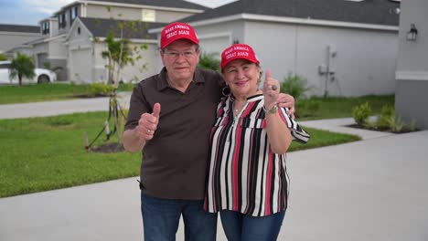 hispanic maga donald trump political supporters under a rainbow wearing red maga hats