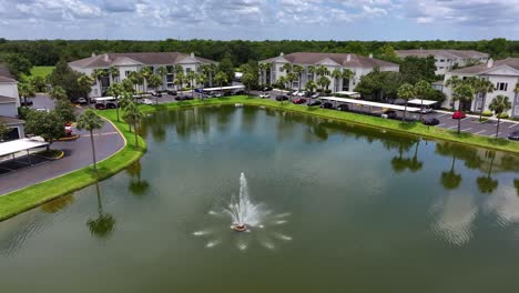 fountain inside lake of modern apartment houses for retirement in florida