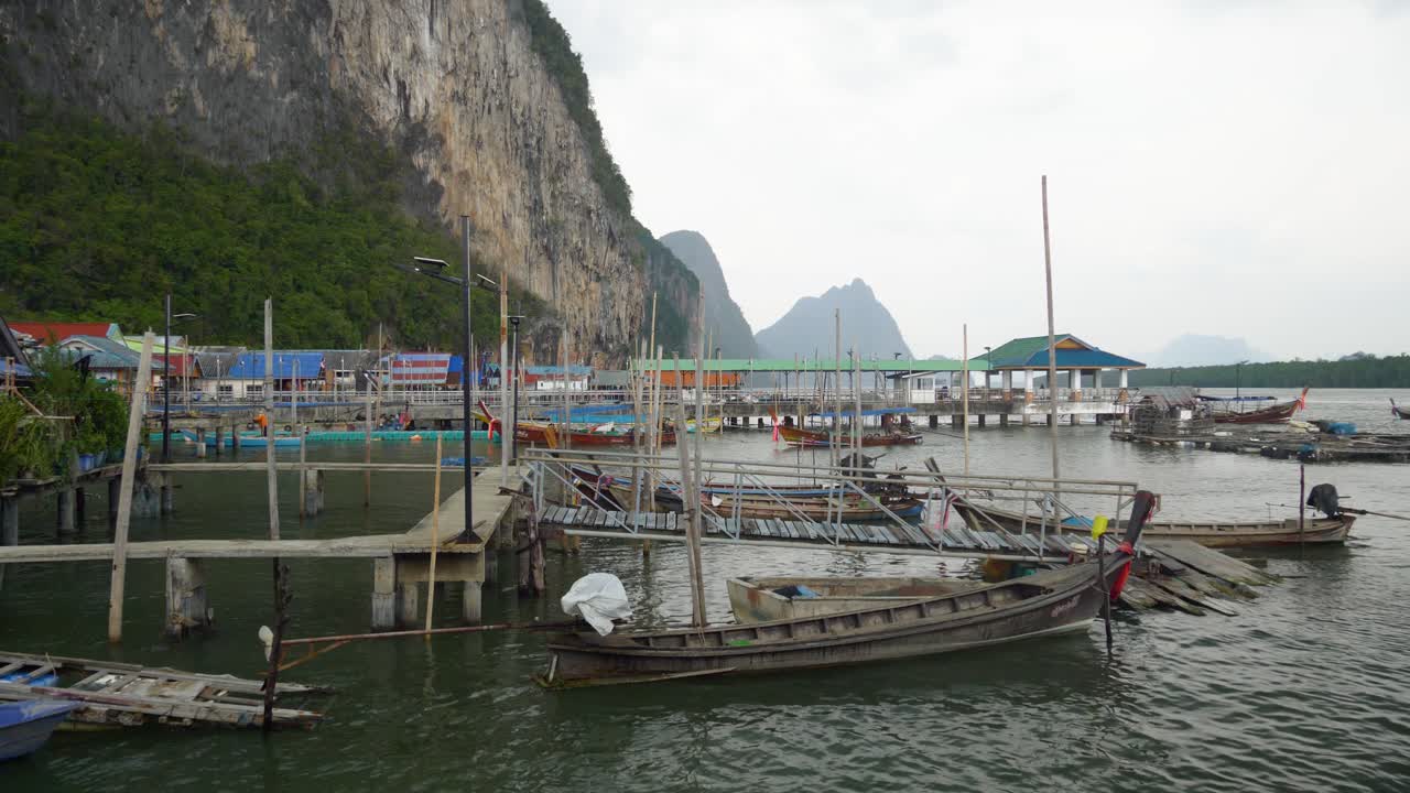 Dock Boats On The Muslim Fishing Village On The Island Of Koh Panyee, Phang Nga Province, Thailand. Static Shot