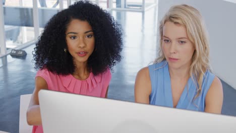 Young women working in a creative office