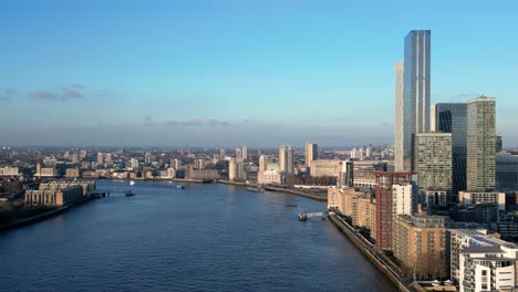 drone view of canary wharf and docklands in london from over the river thames