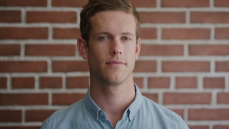 portrait-attractive-young-man-looking-pensive-turns-head-independent-caucasian-male-on-brick-wall-background