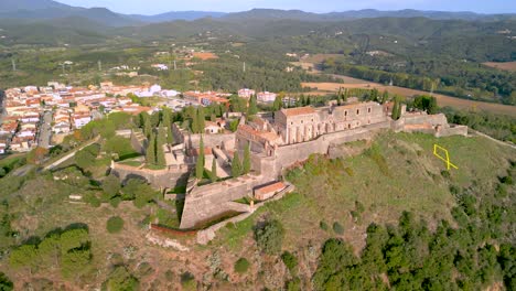 hostalric aerial images medieval town in catalonia touristic castle on top of the mountain hostalric castle is a military fortification closeup of laz or yellow independence symbol