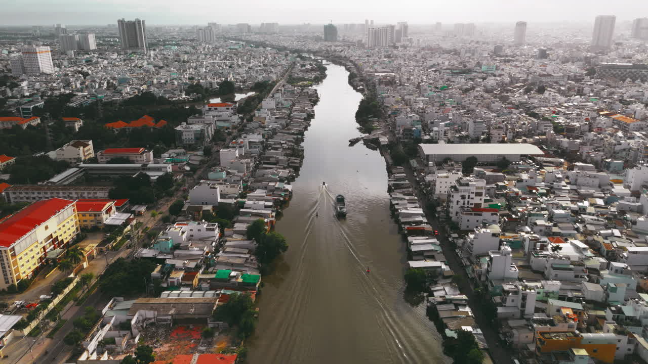 Aerial Boat Passing Through The City River