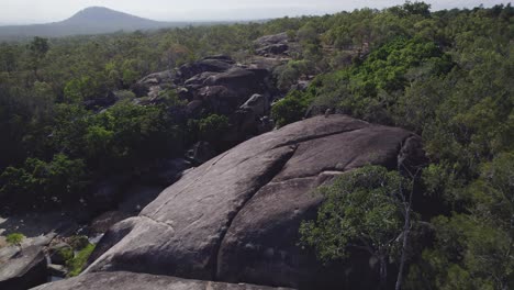 granite gorge nature park with huge granite boulders in qld, australia - drone shot