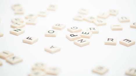 asperger spelled out in plastic letter pieces falling down