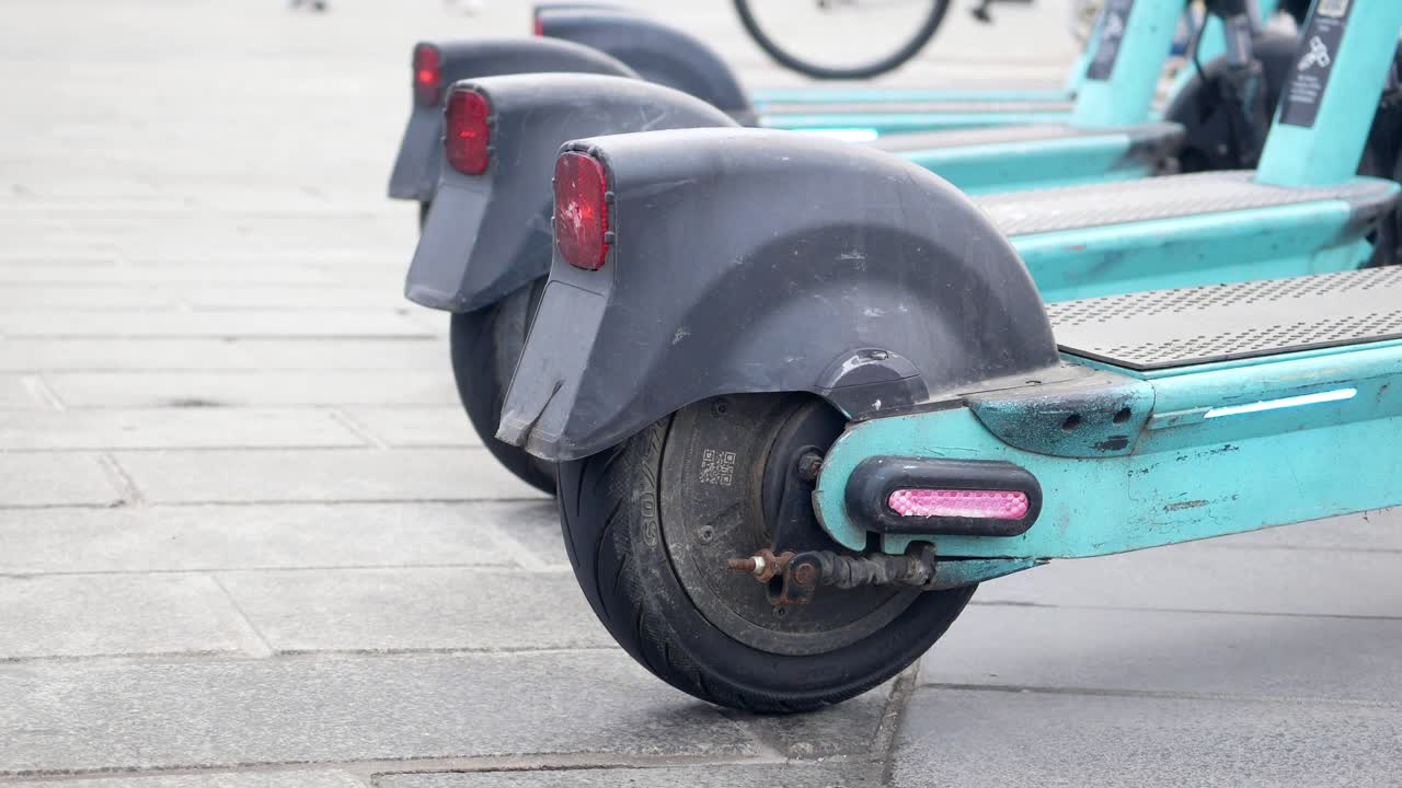 Electric Scooters parked on the sidewalk