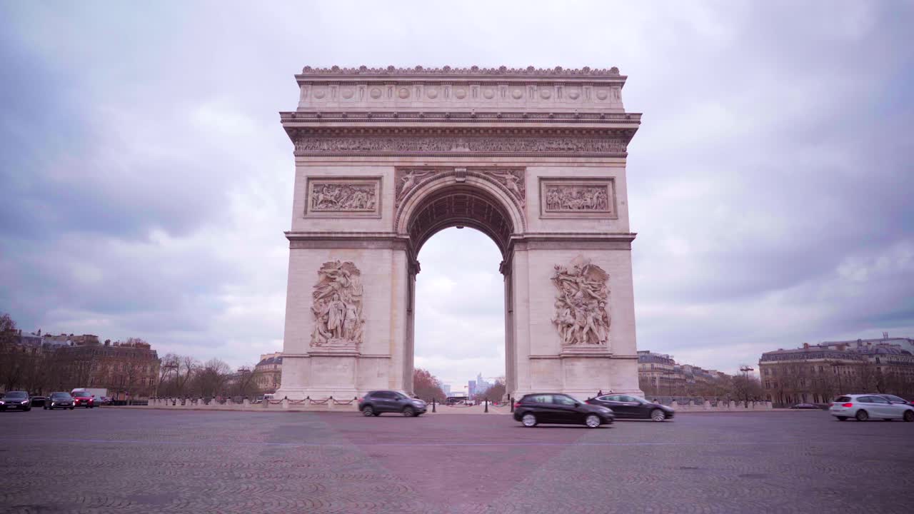 Arc de Triomphe - Arch of Triumph in Paris, tourism in France on a cloudy day