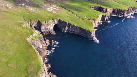 aerial view of breathtaking coastline of scotland on sunny day, yesnaby vista point uk