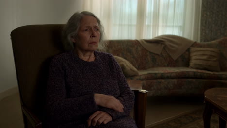 elderly woman sitting in a living room