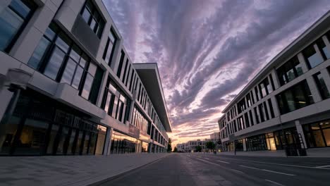 dramatic wide-angle shot of modern buildings at sunset, with dynamic clouds video