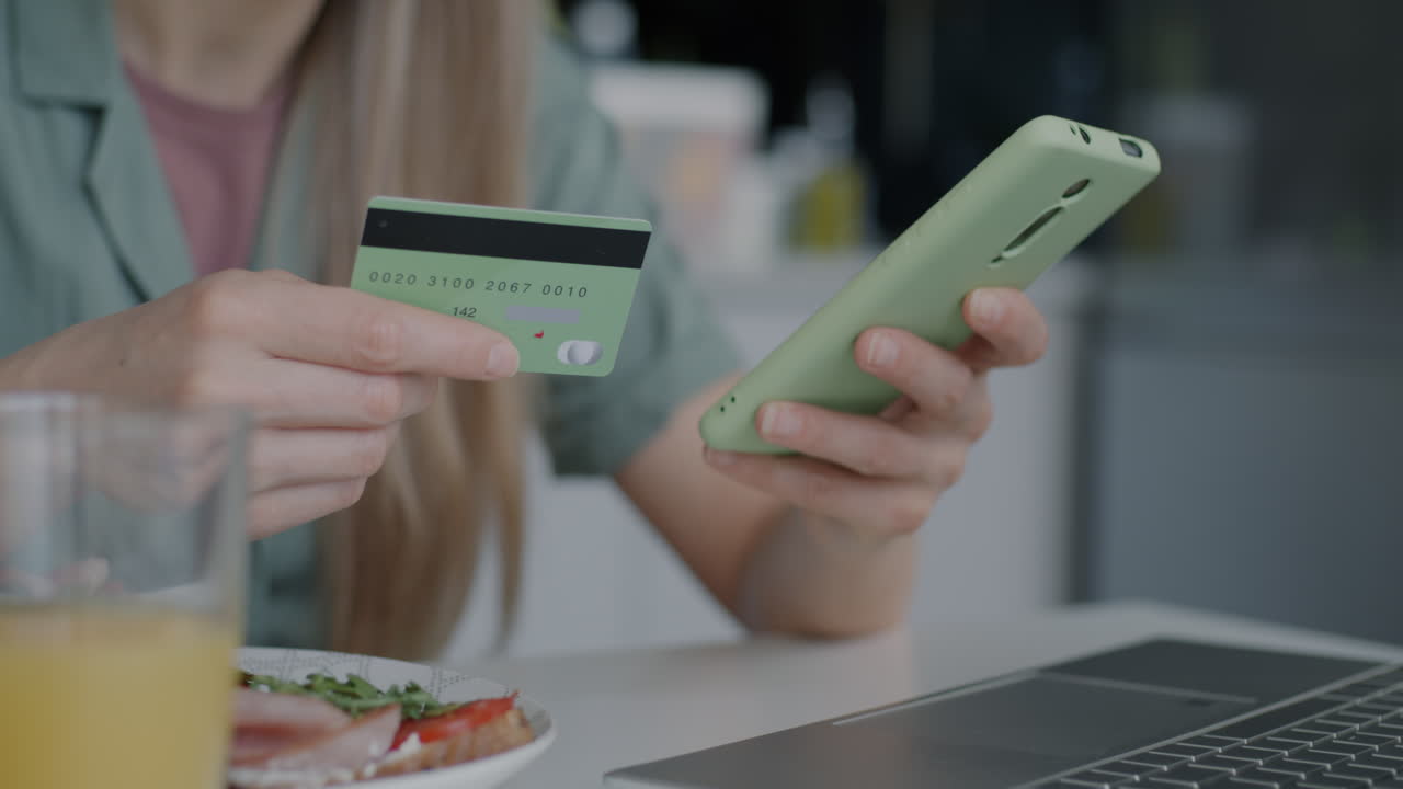 Woman making online payment with credit card