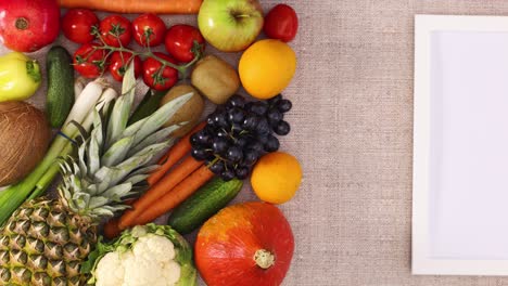 fresh fruits, vegetables and frame for logo or text appear on theme. stop motion