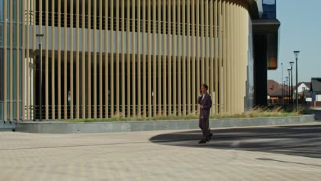 business people walking outside modern building