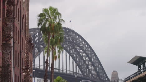 Timelapse-4K-View-Of-People-Climbing-Sydney-Harbor-Bridge-In-Distance-On-Windy-Day-In-Australia