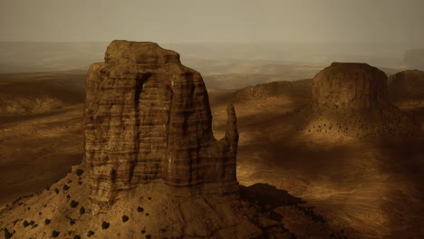 vast desert landscape features majestic rock formations and golden hues