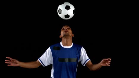 handsome man juggling a football