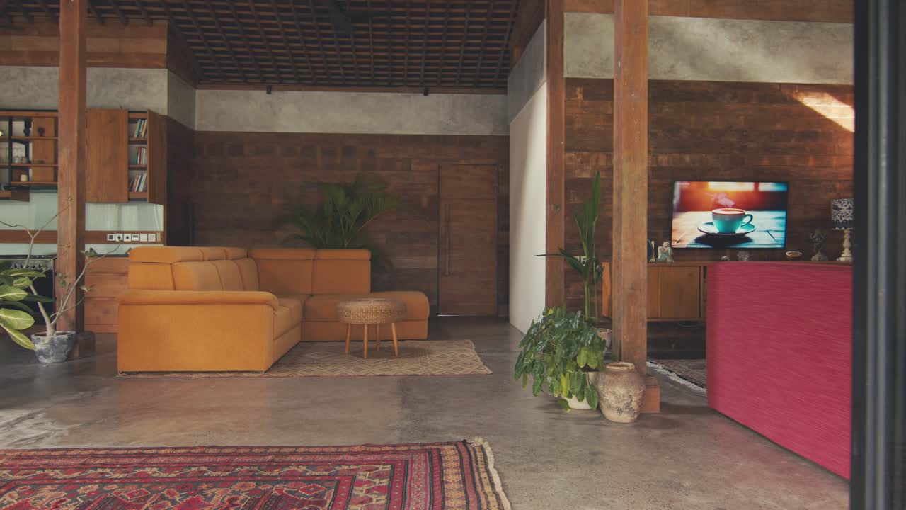 Cozy interior of mansion with living room combined with kitchen in country style