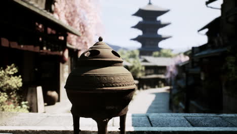 japanese village scene with incense burner