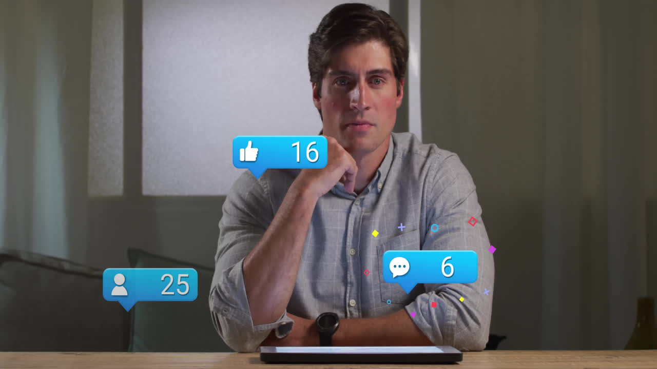 Man sitting at wooden desk in marketing workspace, viewing floating like, comment, follower icons