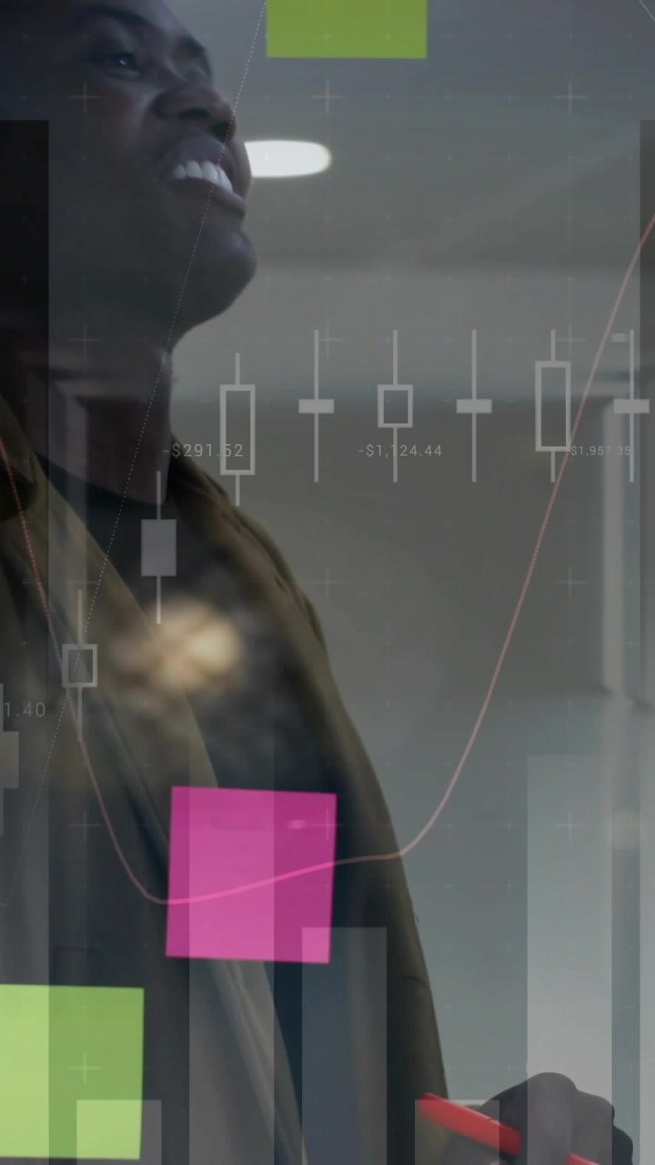 Vertical video: Man reacting to finance charts appearing analyzing tilting smiling pointing stylus
