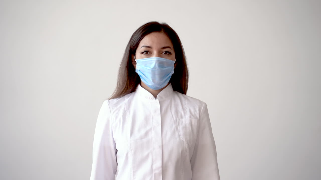 Female Nurse Holding A Syringe And A Vaccine Vial For Covid 19 1